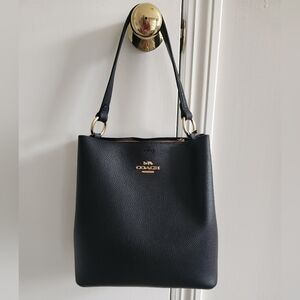 Coach Black Leather Shoulder Bag With Gold Accents.
